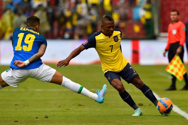 PEST: Leeds United star Raphinha, left, had an impact at both ends of the pitch for Brazil against Ecuador and experienced a running battle with left back Pervis Estupinan, right. Photo by RODRIGO BUENDIA/POOL/AFP via Getty Images.
