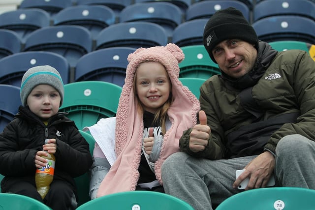 Three PNE fans get ready to watch the game against Bristol City