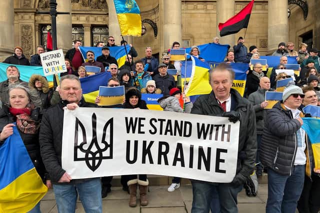 Crowds held 'We Stand with Ukraine' banners