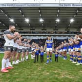Both teams give Tom Briscoe a guard of honour as he enters the field, with his children, ahead of his testimonial game. Picture by Matthew Merrick.