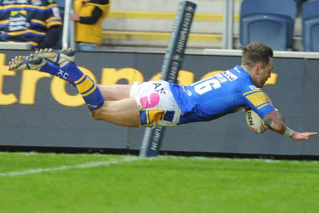 Richie Myler dives over to score for Rhinos. Picture by Steve Riding.