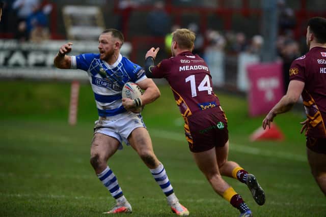 Closing in: Zack McComb, of Halifax Panthers, on the ball as Batley's James Meadows applied the pressure. Picture: James Hardisty