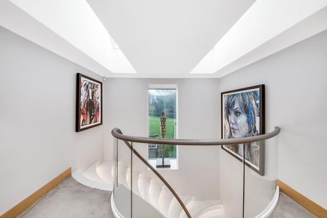 Artworks are shown to great effect at the top of the staircase.