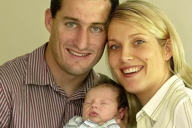 Ben and Kylie Walker pictured with newborn son Sam in 2002. Picture by Streve Riding.