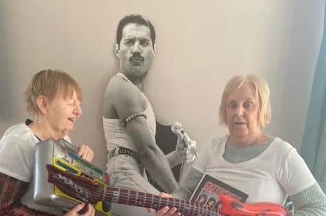 The party saw residents dress up in Queen T-shirts, play with inflatable instruments and enjoy party food