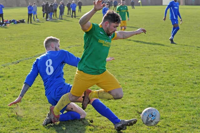 Main Line Social's Matty Dalton is brought down by Kieran Dunn, of Whitkirk Wanderers Sundays, during Sunday's Sanford Cup quarter-final. Picture: Steve Riding.