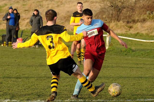 Danny Sooltan, of Rawdon OB, takes on Aberford Albion's Josh Capitano during Saturday's West Yorkshire League Cup tie won by Rawdon, 2-0. Picture: Steve Riding.
