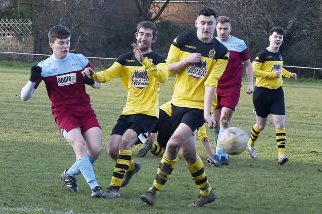 Oliver Jones shoots for Rawdon OB in their 2-0 West Yorkshire League Cup win over Aberford Albion. Picture: Steve Riding.