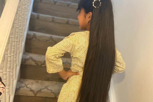Hira-Noor Rashid shows off her hair before having 23 inches cut off for charity.