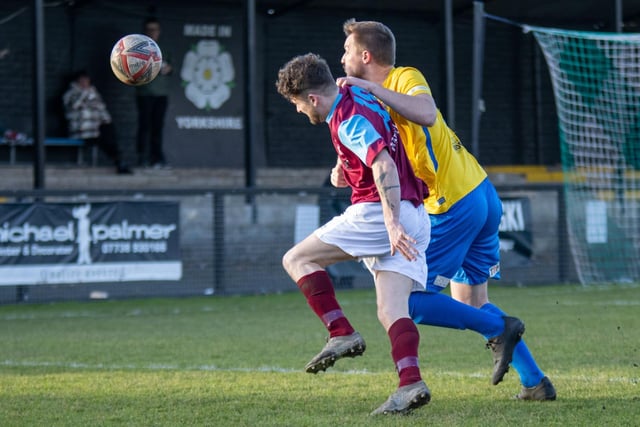Jimmy Eyles tries to get free as Emley attack Albion Sports. Picture: Mark Parsons