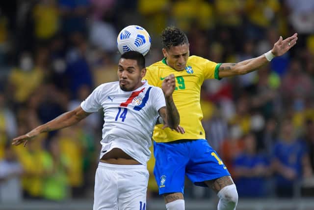 Raphinha battles Hector Martinez for the ball during Brazil's 4-0 victory over Paraguay. Pic: Pedro Vilela.