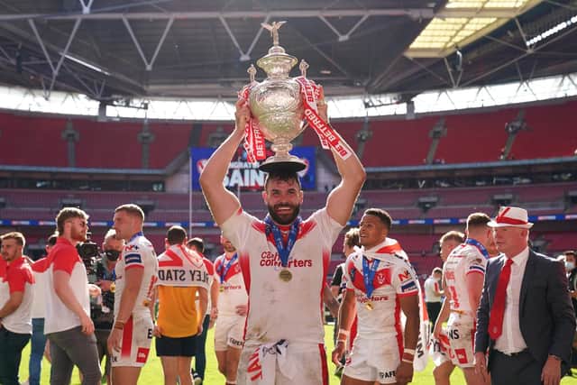 St Helens' Alex Walmsley celebrates with the trophy after the Betfred Challenge Cup final