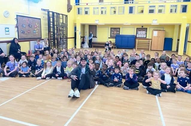 Leeds United captain Liam Cooper with children at Hunslet Primary School. Pic: Joanna Roberts