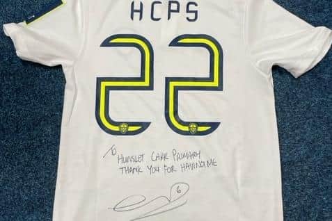The Leeds United shirt donated by Liam Cooper to Hunslet Primary School. Pic: Joanna Roberts