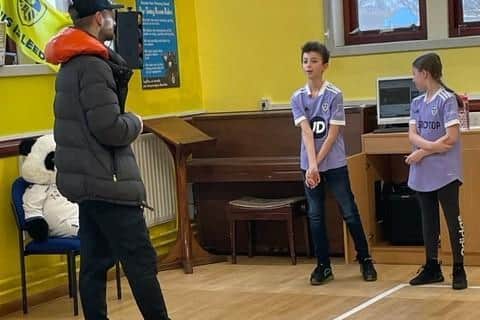 Leeds United captain Liam Cooper answers questions from pupils at Hunslet Primary School. Pic: Joanna Roberts