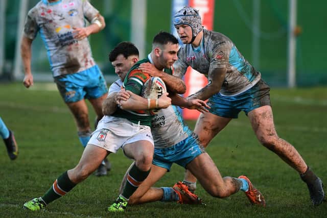 Hunslet's Jordan Paga is tackled by Liam Tindall and Will Gatus (wearing headguard). Picture by Jonathan Gawthorpe.