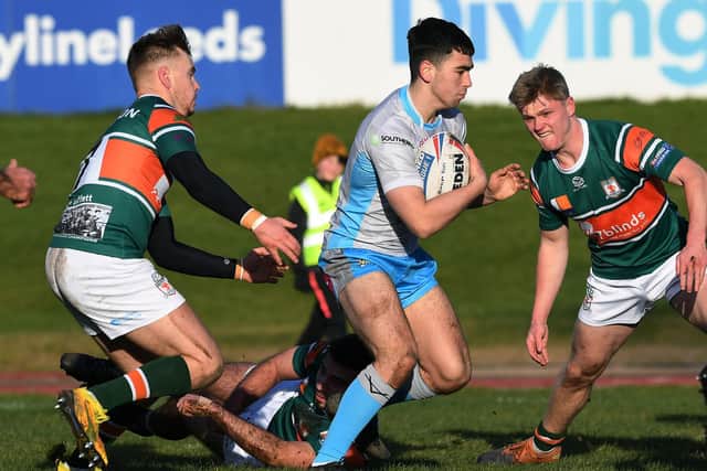 Rhinos' Jack Sinfield takes on the Hunslet defence. Picture by Jonathan Gawthorpe.