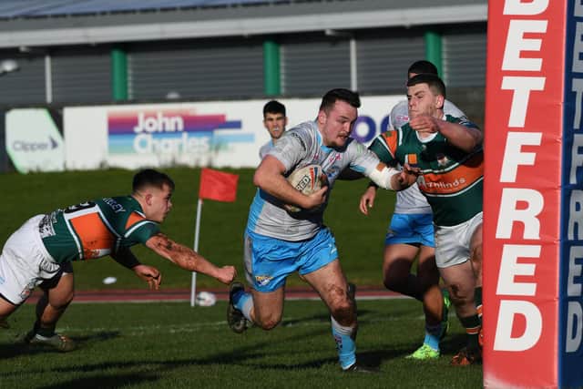 Loui McConnell goes over for Rhinos' only try in the defeat at Hunslet. Picture by Jonathan Gawthorpe.