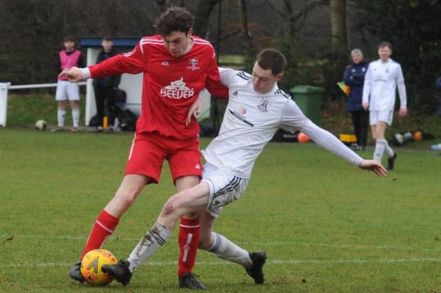 Louis Simmons, of Leeds Medics & Dentists, has his shot blocked by Leeds City Reserves' Sam Roper during Saturday's Yorkshire Amateur League Championship clash. Picture: Steve Riding.