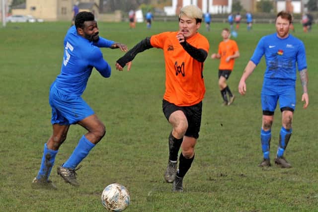 Ishmail Mills, of Little London, is left standing by Leeds Met FC goalscorer Taku Jitsukawa. Picture: Steve Riding.