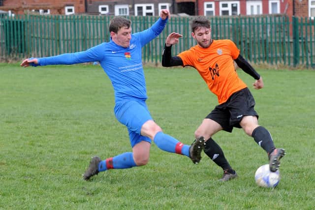 Rob Dagless, of Little London, tries to block Ben Phillips of Leeds Met FC. Picture: Steve Riding.