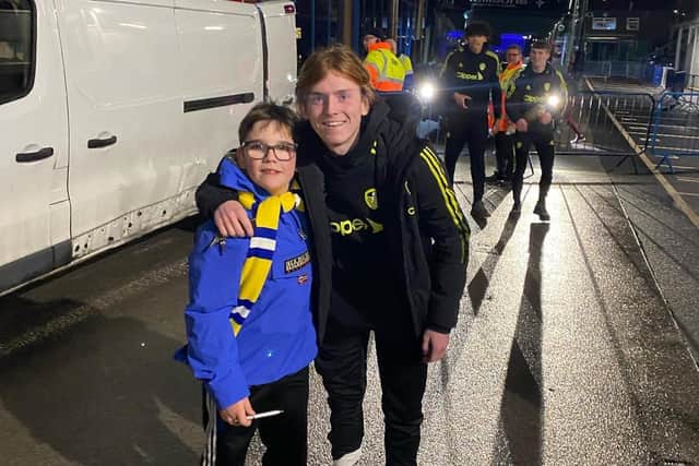 Young Leeds United supporter Henry Doherty outside Elland Road with Sean McGurk. Pic: Lucy Doherty