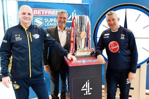 Channel 4's Super League presenter Adam Hills flanked by Leeds Rhinos boss Richard Agar and Daryl Powell, of Warrington Wolves, whose sides meet this weekend. Picture by Simon Wilkinson/SWpix.com.