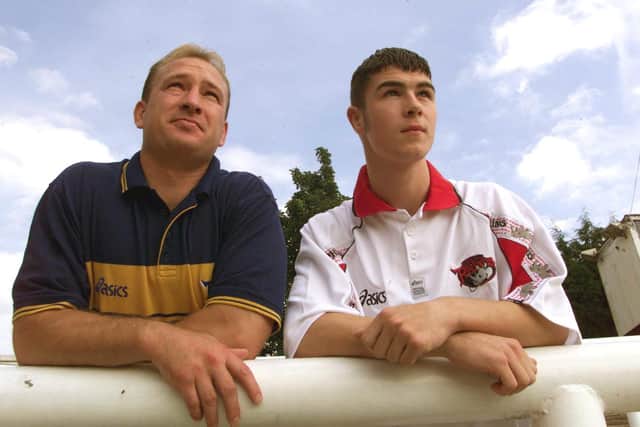 A 15-year-old Richard Mathers with head of youth Dean Bell after signing for Leeds in 1999. Picture by Charles Knight.