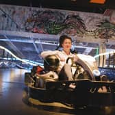 Gravity's co-founder and CEO, Harvey Jenkinson, in one of the state-of-the-art electric karts with Formula One steering wheels