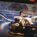 Gravity's co-founder and CEO, Harvey Jenkinson, in one of the state-of-the-art electric karts with Formula One steering wheels