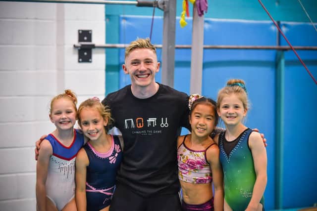Picture shows: Nile Wilson with some young gymnasts
cc Appeal PR