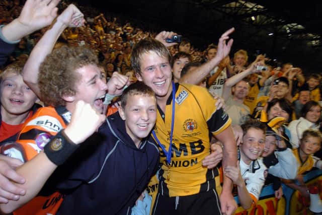 Joe Westerman celebrates with fans after Tigers ' win over Widnes in the 2007 National League One Grand Final. Picture by Tony Johnson.