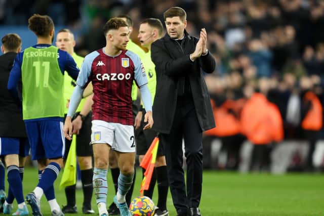 Aston Villa boss Steven Gerrard with Matty Cash at full-time. Pic: Clive Mason.
