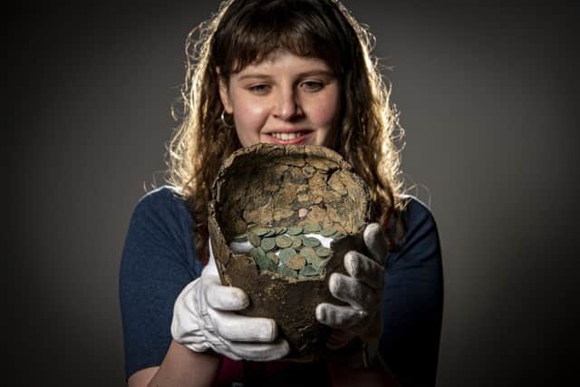 Rachael Dilley curator of exhibitions with the Cridling Stubbs hoard at Leeds City Museum going on display as part of the new Money Talks exhibition. Three hoards found from around Yorkshire including this, a pot containing 3,300 Roman copper coins buried around AD 346 and found in 1967 near Cridling Stubbs in North Yorkshire.  Picture Tony Johnson