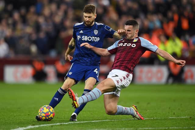 'DISAPPOINTED': Aston Villa midfielder John McGinn, right, challenges Leeds United's Mateusz Klich during Wednesday night's 3-3 draw at Villa Park. Photo by Clive Mason/Getty Images.