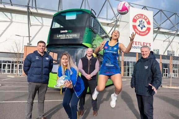 Rhinos women's team star Caitlin Beevers (left) and netball ace Rhea Dixon with Dan Busfield, franchise director of Rhinos Netball, Ross Johnstone of First Bus and club chief executive Gary Hetherington. Picture by First Bus