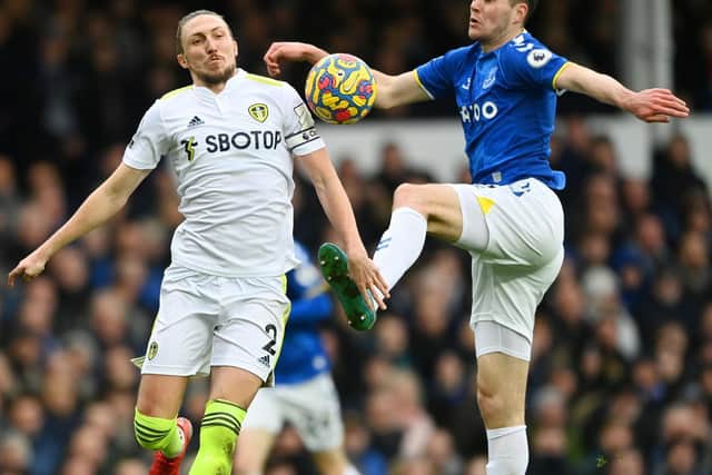 Luke Ayling and Michael Keane tussle for the ball. Pic: Gareth Copley.
