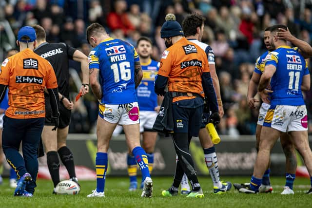 James Bentley leaves the field after being sent off against Warrington while Richie Myler hobbles off with a groin injury.  Picture: Tony Johnson.