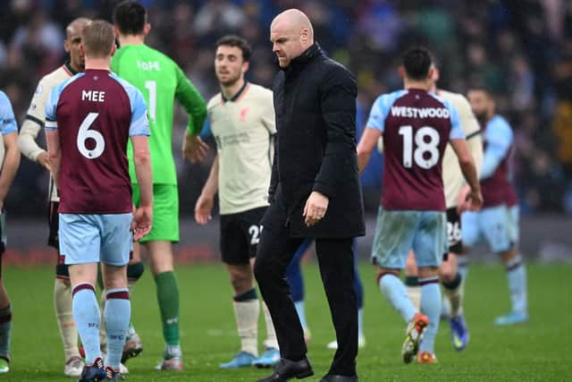 SETBACK: For Burnley and boss Sean Dyche, centre, via a narrow defeat at home to Liverpool on Sunday, above. Photo by Gareth Copley/Getty Images.