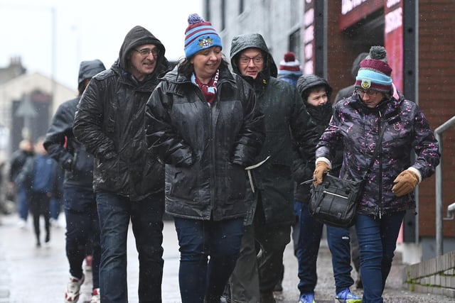 Fans of Burnley arrive at the stadium prior to the Premier League match between Burnley and Liverpool at Turf Moor on February 13, 2022 in Burnley, England.