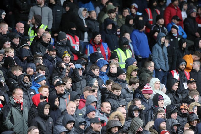 Burnley and Liverpool fans watch their teams in action at Turf Moor