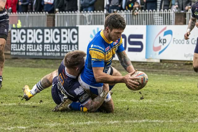 Tom Briscoe scoring against his hometown club Featherstone Rovers in pre-season. Picture by Tony Johnson.
