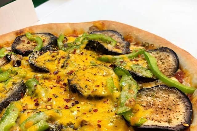 The eclectic menu includes a mix of classic and more adventurous toppings
