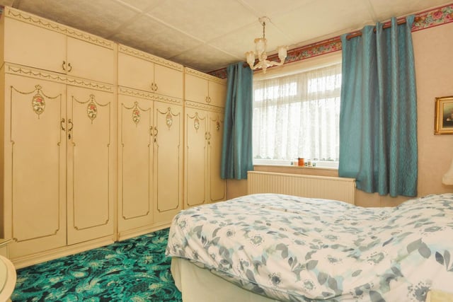 The master bedroom is located on the ground floor, towards the rear of the property.