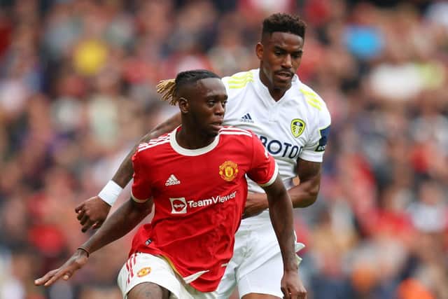 Junior Firpo and Aaron Wan-Bissaka tussle for the ball during Leeds United's 5-1 defeat to Manchester United at Old Trafford in August 2021. Pic: Catherine Ivill.