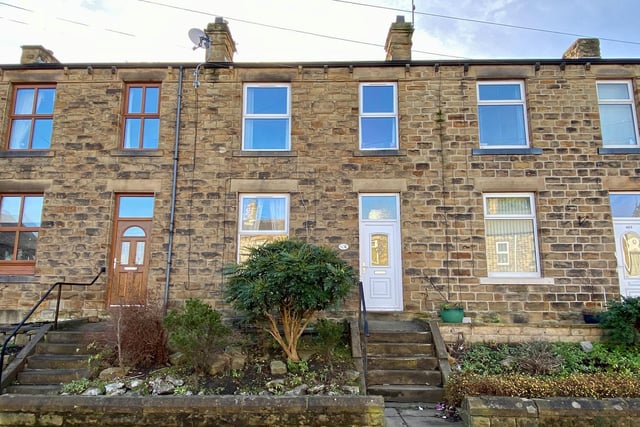 A mid terrace house with a large living room, two bedrooms, a modern shower room and an enclosed garden, with parking to the rear, Close to local amenities. For sale with Whitegates.