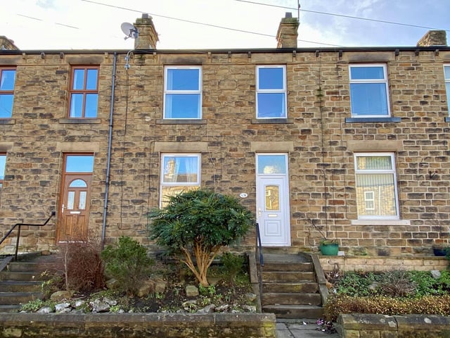 A mid terrace house with a large living room, two bedrooms, a modern shower room and an enclosed garden, with parking to the rear, Close to local amenities. For sale with Whitegates.