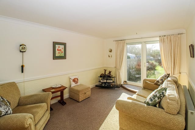 Patio doors open out to the garden from this lounge area within the Horncastle View property.