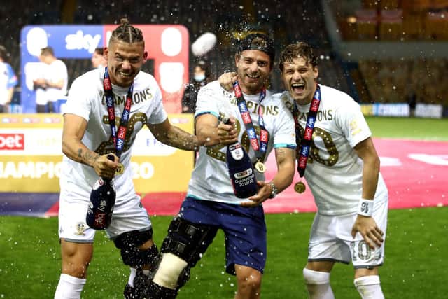 Gaetano Berardi in a leg brace celebrating Leeds United's long-awaited promotion to the Premier League in July 2020. Pic: Tim Goode.