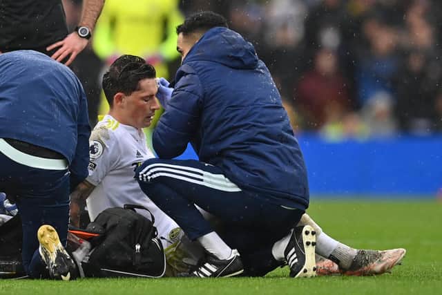 Robin Koch receives treatment for a head injury following a collision with Scott McTominay. Pic: Paul Ellis.